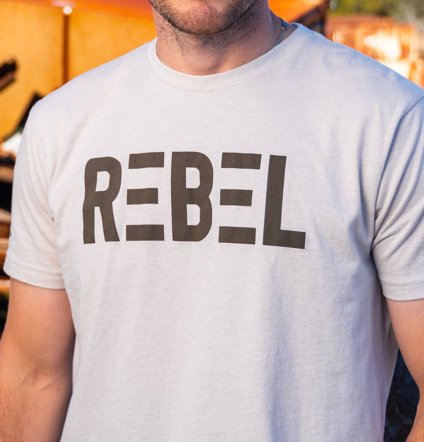 
                  
                    REBEL Light Tan T-Shirt
                  
                